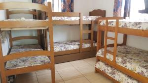 a room with three bunk beds in a room at Chácara Sonia & Mineiro in Igaratá +40 photos