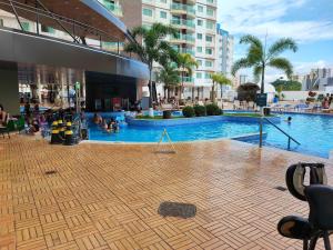 a pool in a building with people playing in it at Riviera Park in Caldas Novas