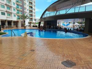 a large swimming pool in the middle of a building at Riviera Park in Caldas Novas