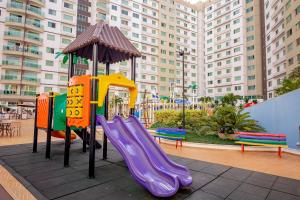 a playground with a slide in a city at Riviera Park in Caldas Novas