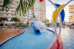 a water park in a city with a water slide at Riviera Park in Caldas Novas