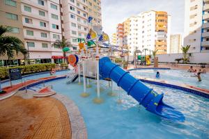 a water slide in a pool in a resort at Riviera Park in Caldas Novas