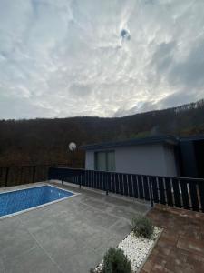a backyard with a swimming pool and a fence at Imperial exclusive apartments in Velika Kladuša