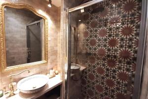 a bathroom with a shower and a sink and a mirror at Midnight in Paris Montmartre in Paris