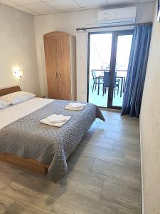 Postel nebo postele na pokoji v ubytování Apartments Ana