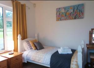 Ein Bett oder Betten in einem Zimmer der Unterkunft Cable Island Bed and Breakfast