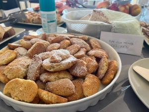 a bowl of donuts sitting on top of a table at Colle Selvotta in Vasto
