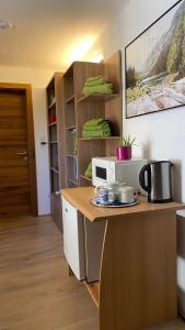 a kitchen with a counter top with a microwave at Relax.Land - Apart Grinzens 90qm Ferienwohnung in Grinzens