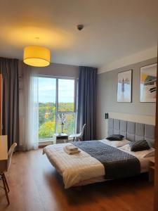 Posteľ alebo postele v izbe v ubytovaní Warsaw Apartments - Luxury Top-view Aparthotel