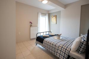 A bed or beds in a room at Dream House Ioannina