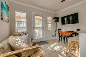 a living room with a couch and a table at Steps to the Beach and Restaurants! - Coconut Villa's Suite 1 in St Pete Beach