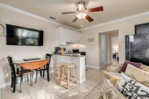a kitchen and living room with a couch and a table at Steps to the Beach and Restaurants! - Coconut Villa's Suite 1 in St Pete Beach