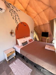 a bedroom with two beds in a tent at Glamping Salta in Cabra Corral +31 photos
