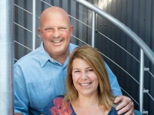 a man and a woman posing for a picture at The Web Suites in Friday Harbor