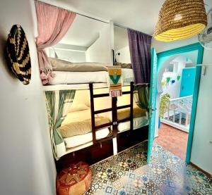 A bed or beds in a room at Darna Hostel