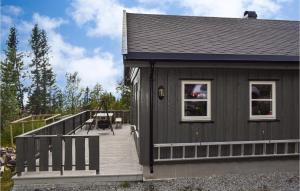 a house with a deck and a playground at 4 Bedroom Pet Friendly Home In Eggedal in Eggedal