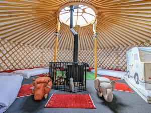a yurt with stuffed animals and a cage in it at Family Hotel Matsumoto Satoyama Doors in Matsumoto