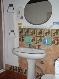 a bathroom with a sink and a mirror at CA' di ROSE B&B VENICE in Venice