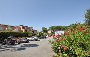 a street with cars parked on the side of the road at Amazing Apartment In Sainte-Maxime in Sainte-Maxime