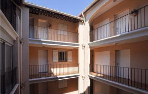 an empty building with balconies on the side of it at Amazing Apartment In Sainte-Maxime in Sainte-Maxime +10 photos