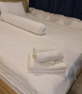 Postel nebo postele na pokoji v ubytování ทีพักติดหาดแหลม​แม่พิมพ์​Mantra Condo​ Rayong​