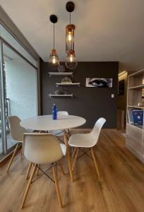 a dining room with a table and chairs at Modern Apartment in the Heart of Quito in Quito