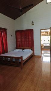 a bedroom with a large bed in a room at The Four Seasons in Kalpetta