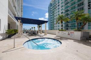 a small swimming pool on a balcony of a building at Superb unit, centrally located with parking in Miami