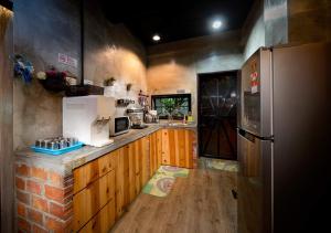 a kitchen with a refrigerator and a counter top at ECO Haus Garden Residential in Johor Bahru
