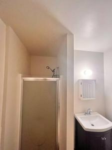 a bathroom with a shower and a sink at 2 BR Private Suite Near Major Hospitals, Yale & DT in Woodbridge