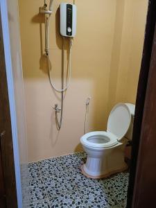 a bathroom with a toilet and a shower at Sunshine Hotel Kampot in Kampot