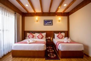 Letto o letti in una camera di Hotel Ghyampe Dada