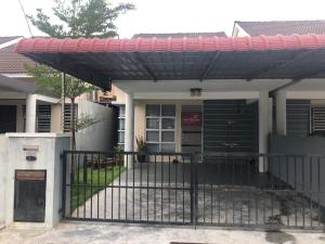 a house with a gate in front of it at Miker Homestay in Seri Iskandar
