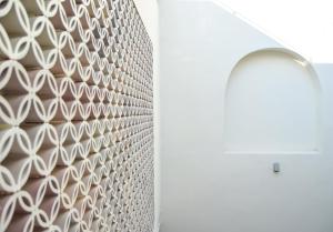 a wall with a white patterned wall at Apartamentos La Higuera by VGH in Jerez de la Frontera +61 photos