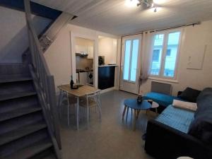 Televízia a/alebo spoločenská miestnosť v ubytovaní Appartement duplex avec garage Annecy centre et Lac