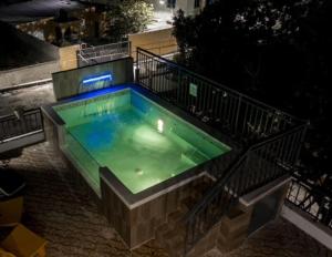 a swimming pool with a green liquid in it at Casa Ozuna in Mendoza