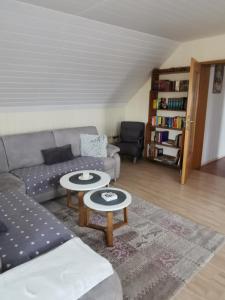 a living room with a couch and a table at Zur langen Heide in Hildburghausen