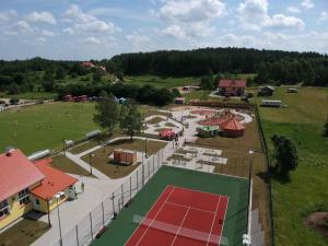 an aerial view of a park with a tennis court at Apartament Krucze Łąki in Kruklanki
