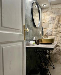 a bathroom with a sink and a mirror at Dimora Picco Bello in Trogir +60 photos