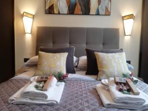 En eller flere senger på et rom på Napoli Mariana Luxury
