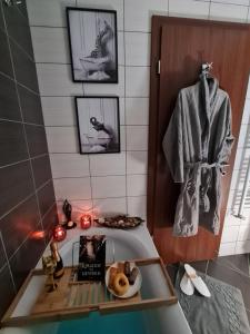 a bathroom with a sink with a book and a towel at Mountain Peak Apartment in Borovets