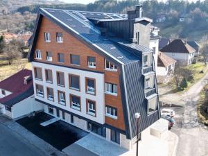 an overhead view of a building with solar panels on it at WILD BEAUTY Apartment-Modern mountain 2 in Kolašin