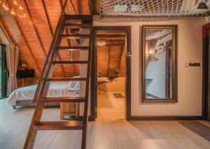 Postel nebo postele na pokoji v ubytování Kenaray Farmstay riverside