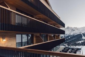 a building with a view of the mountains at Hotel Schöne Aussicht in Sölden