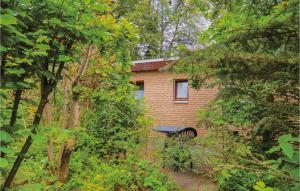 a brick building with a bench in front of it at 1 Bedroom Awesome Home In Prmzurlay in Prümzurlay