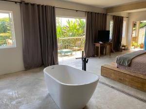 Katil atau katil-katil dalam bilik di Hotel Boutique Ananas