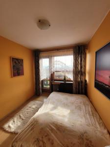 Łóżko lub łóżka w pokoju w obiekcie Apartament Rita