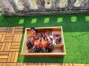 a wooden box filled with lots of different colored bows at Grandmother's Vegetable garden in Anseong