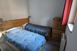Posteľ alebo postele v izbe v ubytovaní Appartement 6/8 pers à 200 m des pistes - piscine