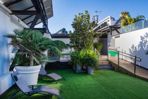 Vonkajšia záhrada v ubytovaní Coccoloba Suites Corralejo